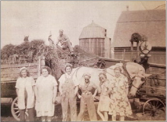 A Smith and a Wooden Threshing Machine