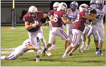 Payton Borchardt runs for Mayville. ….